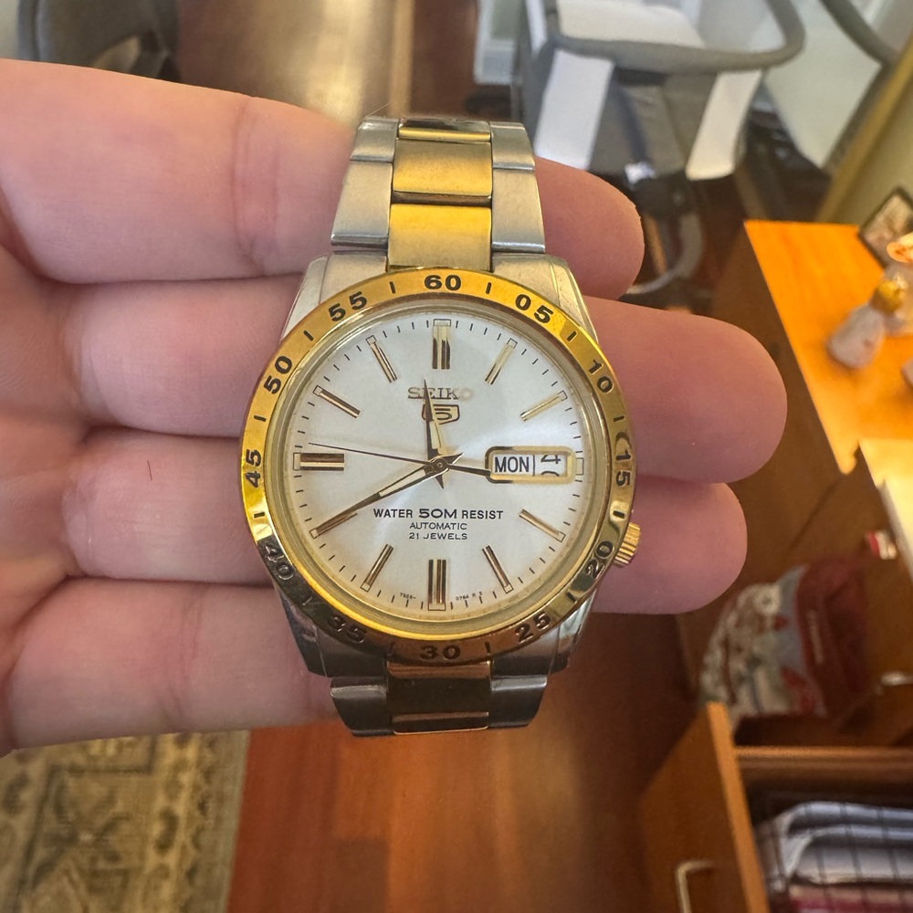 Seiko Gold and Silver Watch with Day-Date Feature